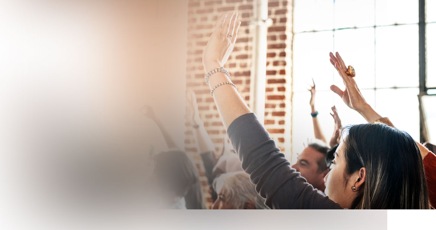 A community raising hands to build the movement
