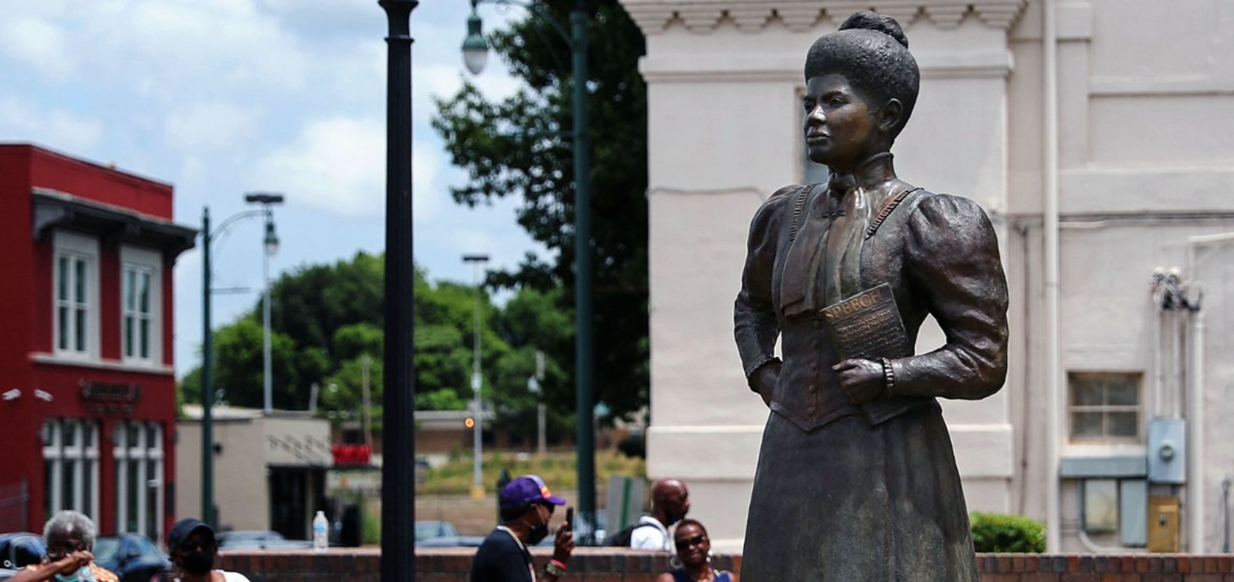 Bronze statue of Ida B. Wells at the Ida B. Wells Plaza in Memphis, holding her Speech